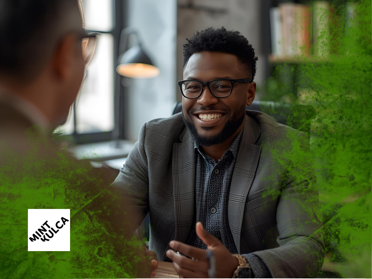 Candidate being interviewed in an office setting, used to illustrate the hiring mistakes recruiters should avoid during interviews.