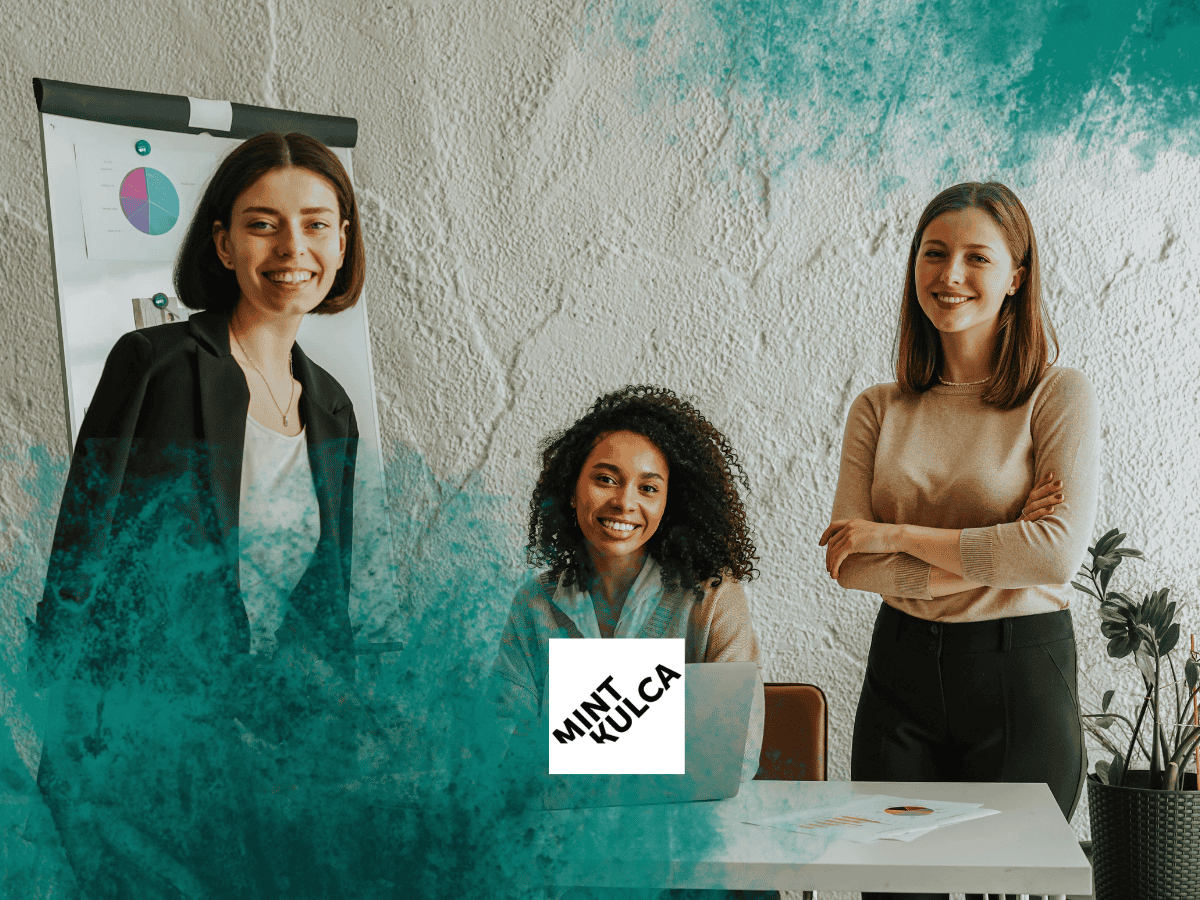 Three professionals collaborating in an office, representing confident hiring and building strong teams.